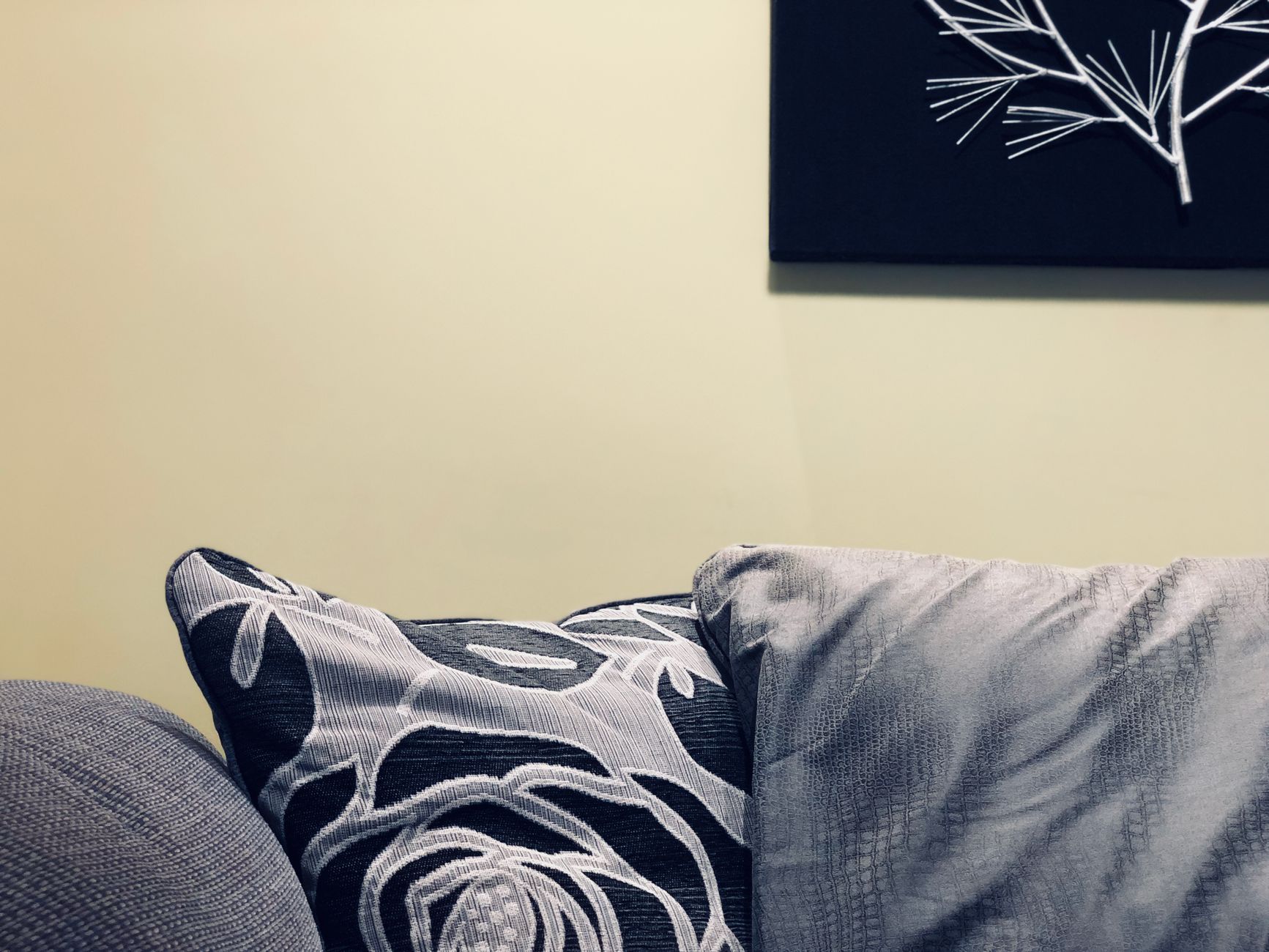 Gray and black floral throw pillow close-up